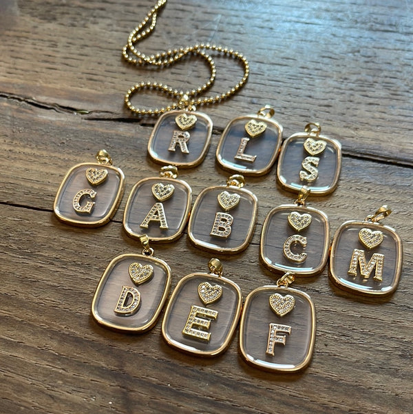 NECKLACE WITH TRANSPARENT LETTER AND HEART PLATE
