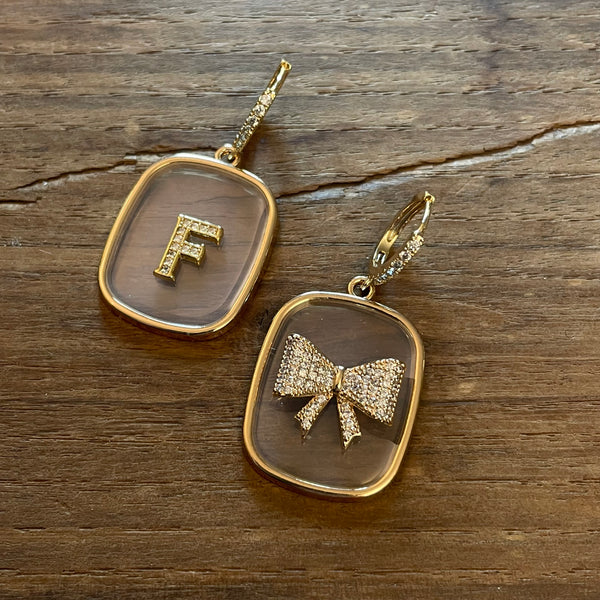TRANSPARENT PLATE EARRINGS with letters and BOW