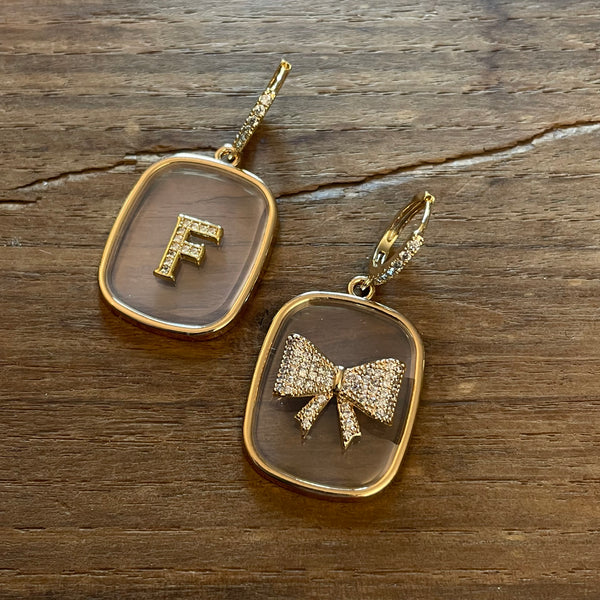TRANSPARENT PLATE EARRINGS with letters and BOW