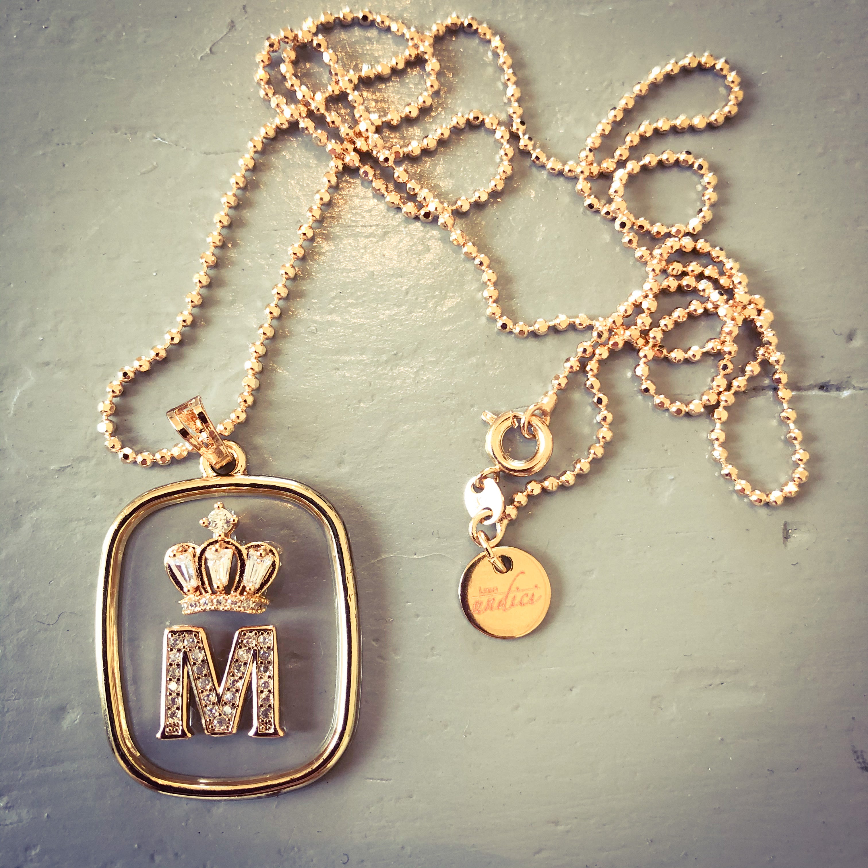 NECKLACE WITH TRANSPARENT LETTER PLATE PLUS CROWN